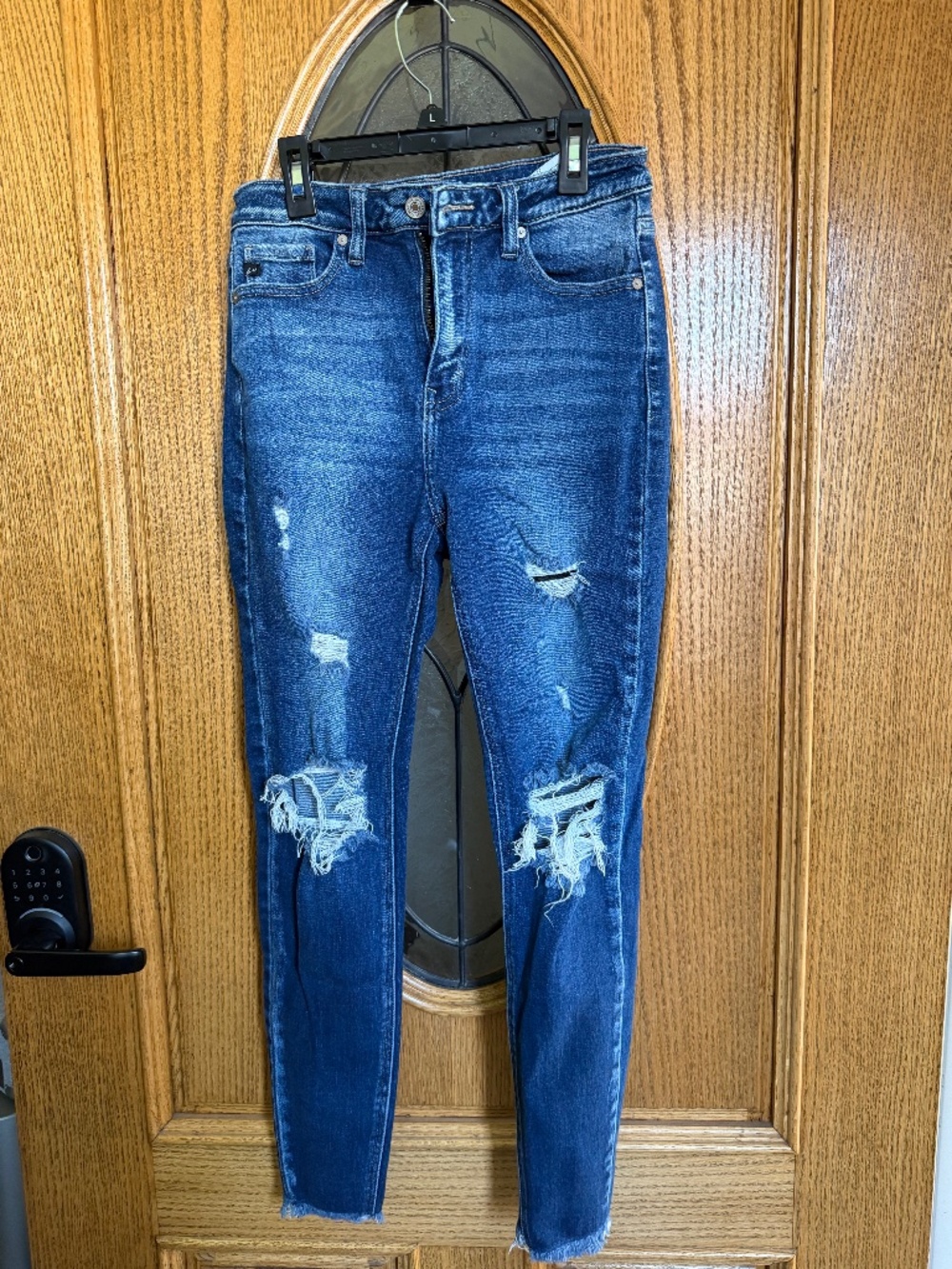 KanCan High-waisted blue denim jeans with distressed details. Size: 27"